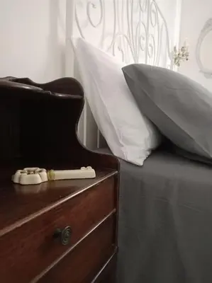 Letto o letti in una camera di La Casa di Madhu