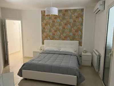 Letto o letti in una camera di Casa Vacanze Le Tre Scimmiette Chic