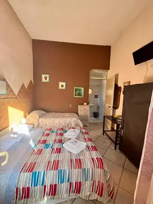 Letto o letti in una camera di B&B Ai piedi dell'Etna