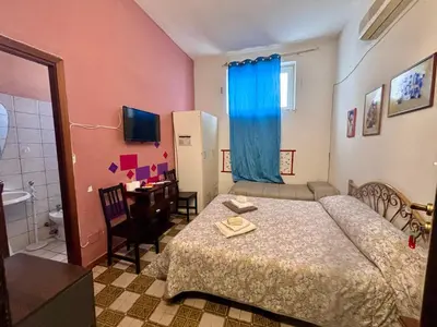 Letto o letti in una camera di B&B Ai piedi dell'Etna