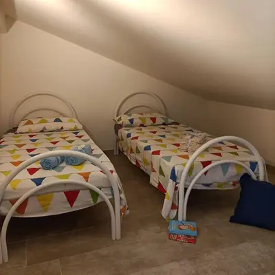 Letto o letti in una camera di The Bays - La Mansarda ad un passo dal mare