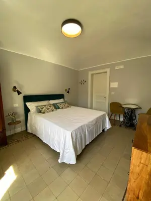 Letto o letti in una camera di Dimora dei Minoriti