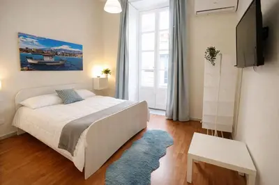 Letto o letti in una camera di Etnea Rooms 270