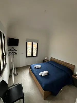 Letto o letti in una camera di Casa Ginestra di Palazzo Biondi