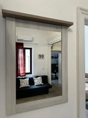 Letto o letti in una camera di Casa Betulla di Palazzo Biondi
