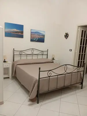Letto o letti in una camera di Fior dell'Etna