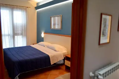 Letto o letti in una camera di L'Infinito Agriturismo - Rooms & Breakfast