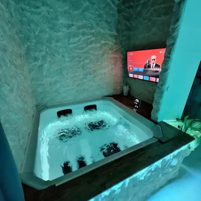 TV o dispositivi per l'intrattenimento presso Dark & Light rooms & luxury suites