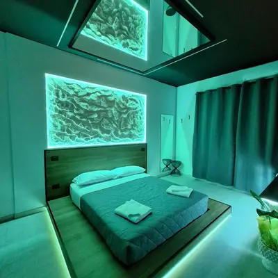 Letto o letti in una camera di Dark & Light rooms & luxury suites