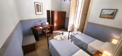 Letto o letti in una camera di Palazzo Vitrano Tourist Apartment 1