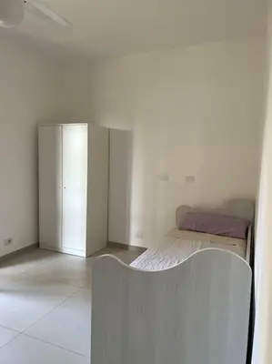 Letto o letti in una camera di Relax Sea Capomulini Appartamento su due livelli