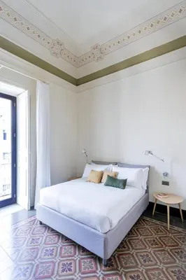 Letto o letti in una camera di Palazzo Costarelli - Bed and Breakfast