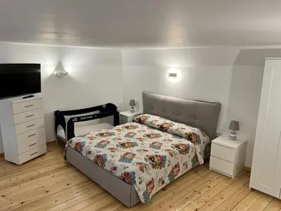 Letto o letti in una camera di Binario82