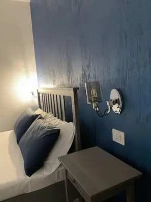 Letto o letti in una camera di Delia’s Apartments