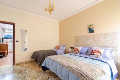 Letto o letti in una camera di Casa Aurora a due passi dalla ferrovia
