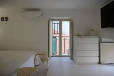 Letto o letti in una camera di Casa Vacanze Marta Aci Trezza