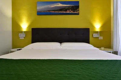 Letto o letti in una camera di Casa Italia