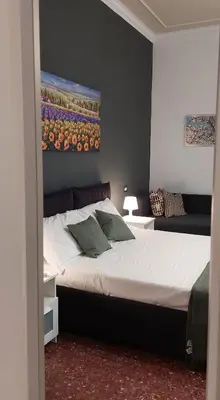 Letto o letti in una camera di Casa Italia