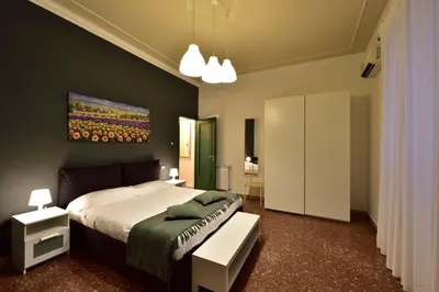 Letto o letti in una camera di Casa Italia