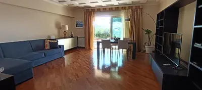 Area soggiorno di Pirandello Apartment Acitrezza