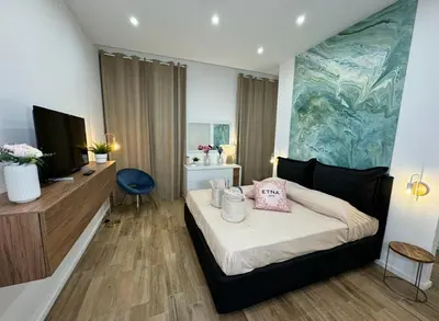 Letto o letti in una camera di Casa Belfiore Etna-apartments