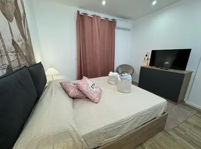 Letto o letti in una camera di Casa Belfiore Etna-apartments