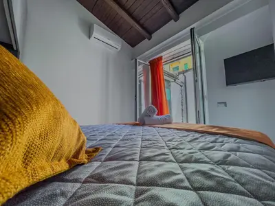 Letto o letti in una camera di Domus Cerere
