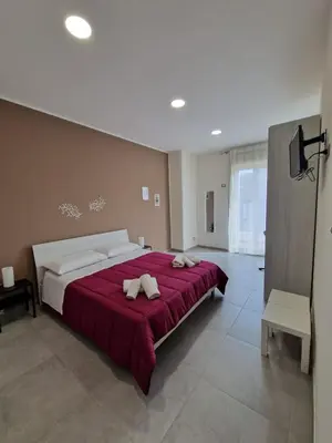 Letto o letti in una camera di B&B Sei Palme