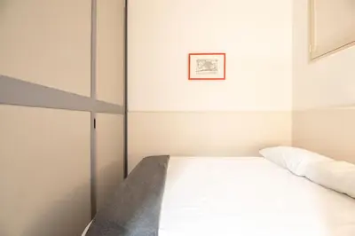 Letto o letti in una camera di Genova Loft, City Centre Shopping District