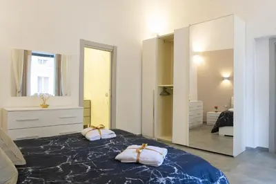 Letto o letti in una camera di Leoscar Apartment in Catania center Self Check-in