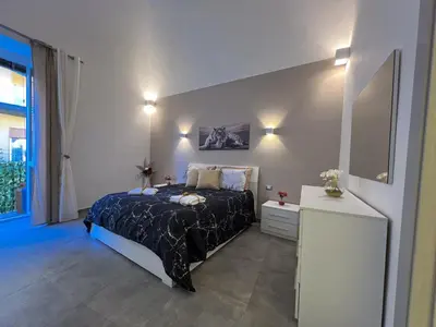 Letto o letti in una camera di Leoscar Apartment in Catania center Self Check-in
