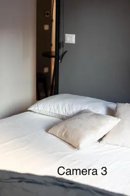 Letto o letti in una camera di Berht - Appartamenti al centro di Catania