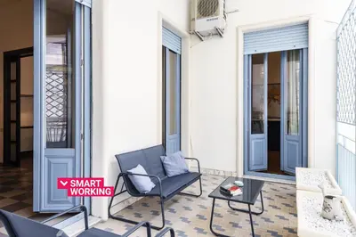 Area soggiorno di Agata Apartment with Balcony by Wonderful Italy