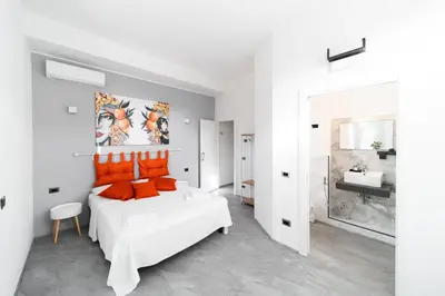 Letto o letti in una camera di VOLCANO'S SUITE - AGRUMI - The First Eco - Chic Suites in Sicily