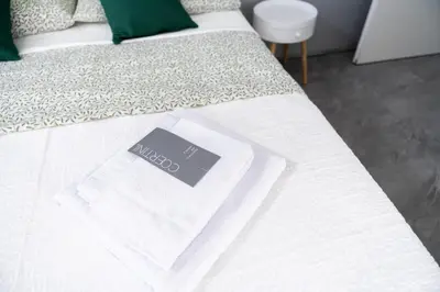 Letto o letti in una camera di VOLCANO'S SUITE - ULIVO - The First Sustainable Eco - Chic Suite in Sicily