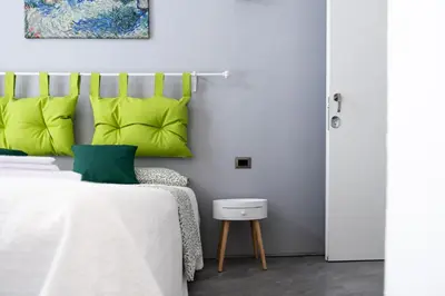 Letto o letti in una camera di VOLCANO'S SUITE - ULIVO - The First Sustainable Eco - Chic Suite in Sicily