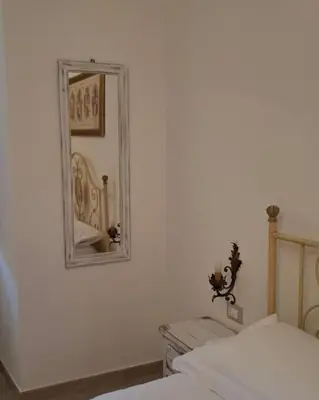 Letto o letti in una camera di Casa vacanze Vico Minaudo