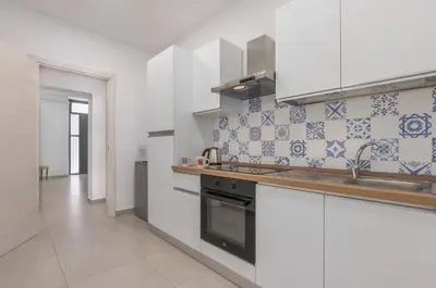 Cucina o angolo cottura di GuestHost - Parco Falcone Borsellino Modern Flat