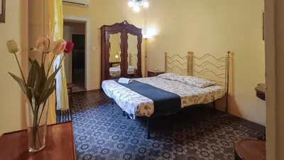 Letto o letti in una camera di Casa Rossi