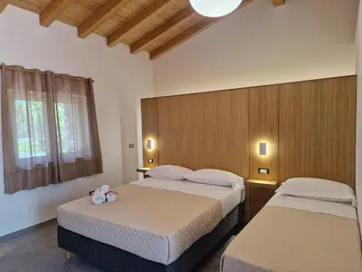 Letto o letti in una camera di Agriturismo Lumia Resort
