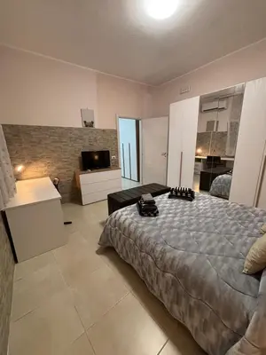 Letto o letti in una camera di Pancho House Catania