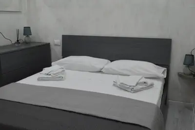 Letto o letti in una camera di Adriano's Rooms
