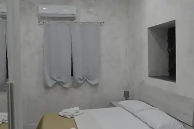 Letto o letti in una camera di Adriano's Rooms