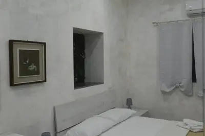 Letto o letti in una camera di Adriano's Rooms