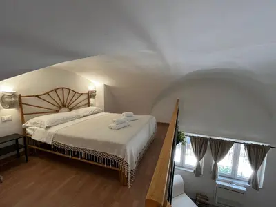 Letto o letti in una camera di Il Cortiletto