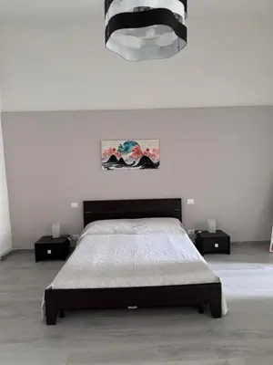 Letto o letti in una camera di Jonia Apartments