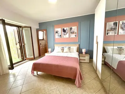 Letto o letti in una camera di MELA your home between Sea and Etna