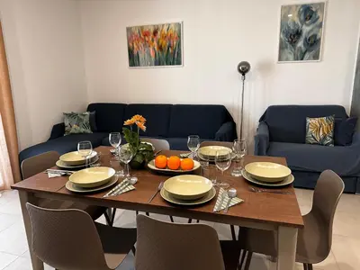 Area soggiorno di MustLoveSicily - New apartment with Etna and sea view