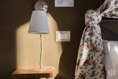 Letto o letti in una camera di Grand Tour Design Guest House Catania Self Check-in