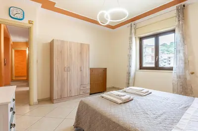 Letto o letti in una camera di GuestHost - Apartment with Terrace in Aci Catena